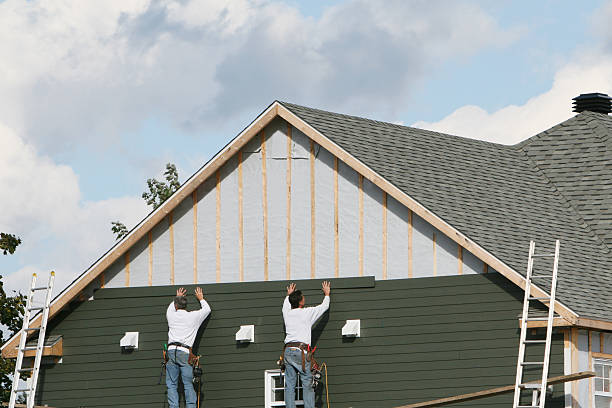 Professional Storm Damage Siding Repair technician working in Montgomery, OH